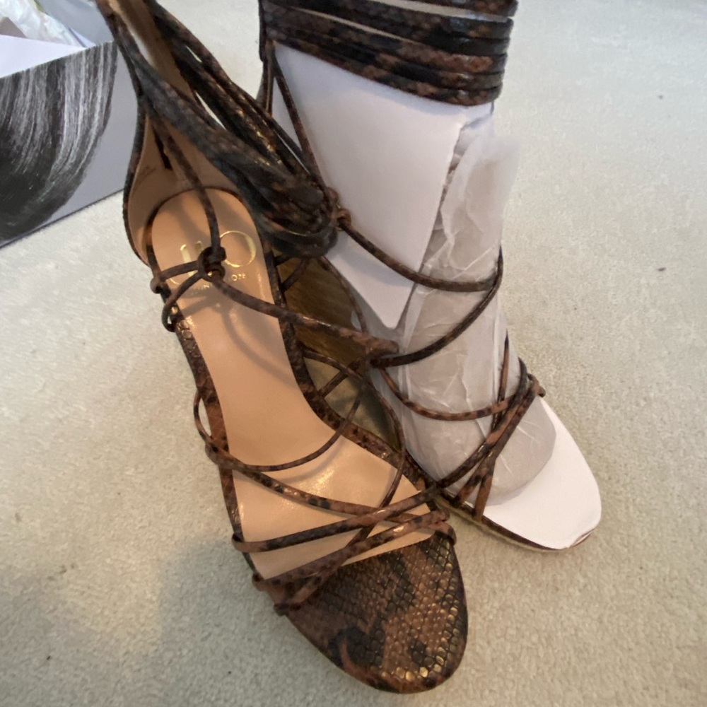 Never worn JLO espadrilles with tie up and zipper back.